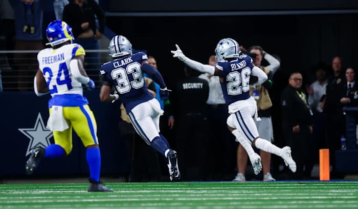 Oct 29, 2023; Arlington, Texas, USA; Dallas Cowboys cornerback DaRon Bland (26) scores a touchdown on an interception during the first quarter against the Los Angeles Rams at AT&T Stadium